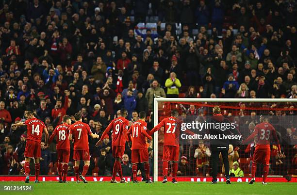 Jurgen Klopp, manager of Liverpool and player salute The Kop after the Barclays Premier League match between Liverpool and West Bromwich Albion at...