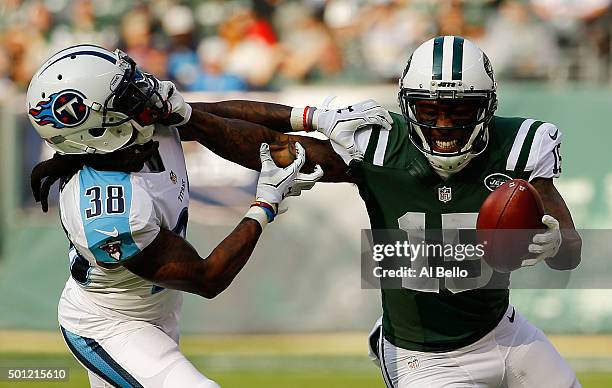 Brandon Marshall of the New York Jets grabs the face mask of B.W. Webb of the Tennessee Titans as he tries to avoid his tackle in the first quarter...