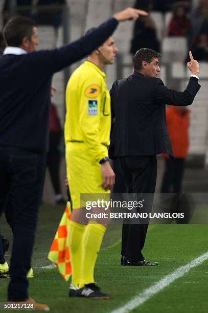 Marseille's Spanish head coach Jose Miguel Gonzalez Martin del Campo aka Michel and Ajaccio's head coach Thierry Laurey gesture during the French L1...