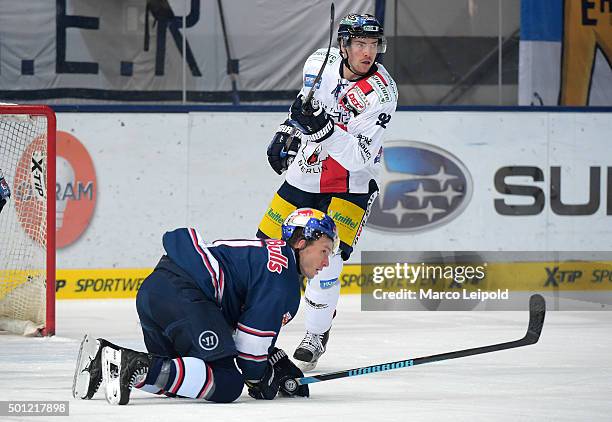 Keith Aucoin of EHC Red Bull Muenchen and Marcel Noebels of the Eisbaeren Berlin during the game between EHC Red Bull Muenchen and the Eisbaeren...