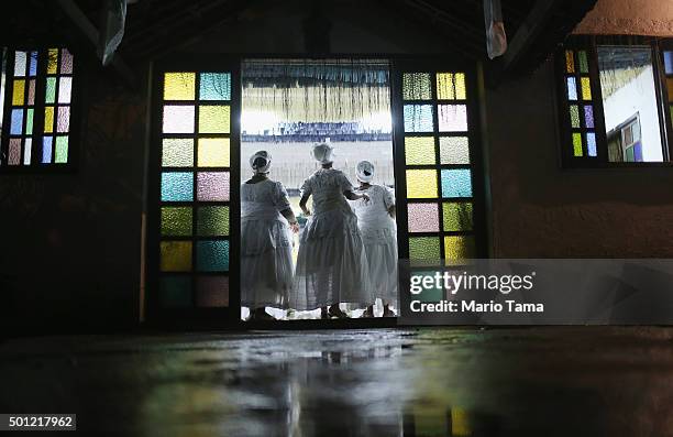 Worshippers dance during a Candomble ceremony honoring goddesses Iemanja and Oxum on December 12, 2015 in Itaborai, Brazil. Candomble is an...