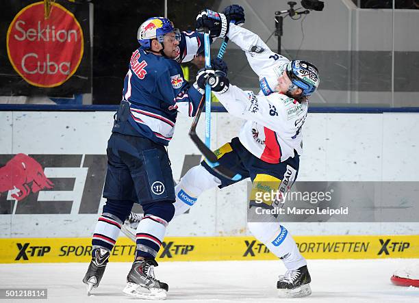 Jerome Samson of EHC Red Bull Muenchen and Florian Busch of the Eisbaeren Berlin during the game between EHC Red Bull Muenchen and the Eisbaeren...
