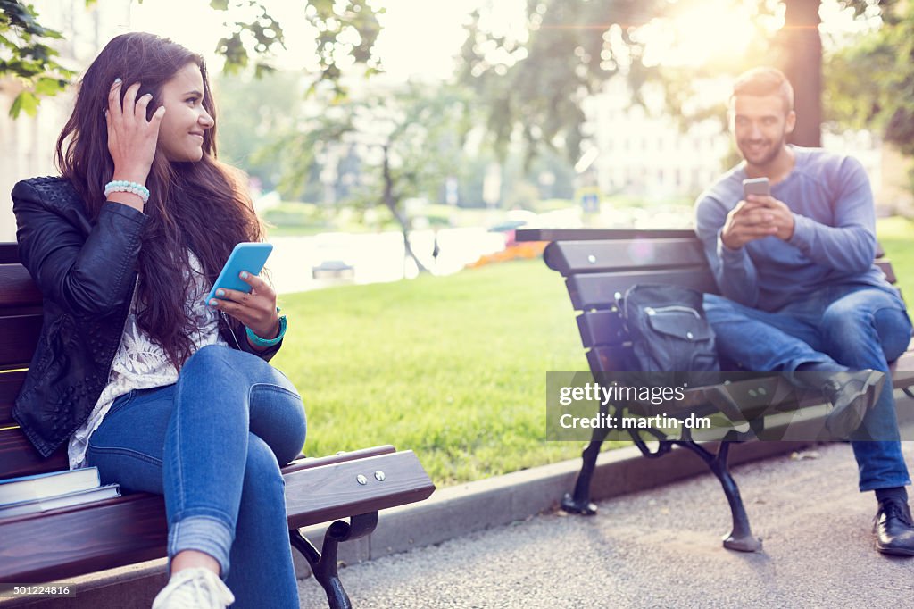 Flirting couple in the park