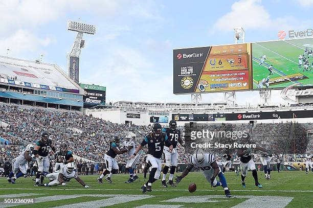 Robert Mathis of the Indianapolis Colts recovers a fumble for a touchdown during the second quarter of a game against the Jacksonville Jaguars at...