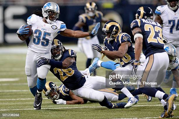 Mark Barron of the St. Louis Rams attempts to tackle Joique Bell of the Detroit Lions as he carries the ball in the third quarter at the Edward Jones...