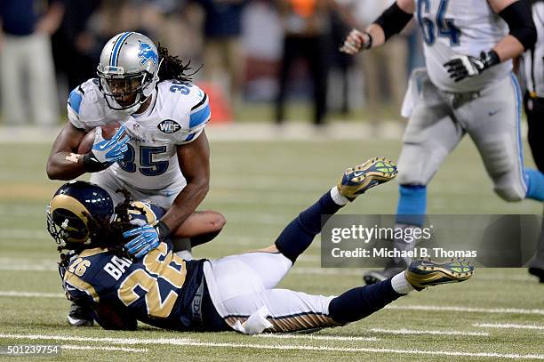 Theo Riddick of the Detroit Lions is tackled by Mark Barron of the St. Louis Rams in the fourth quarter at the Edward Jones Dome on December 13, 2015...