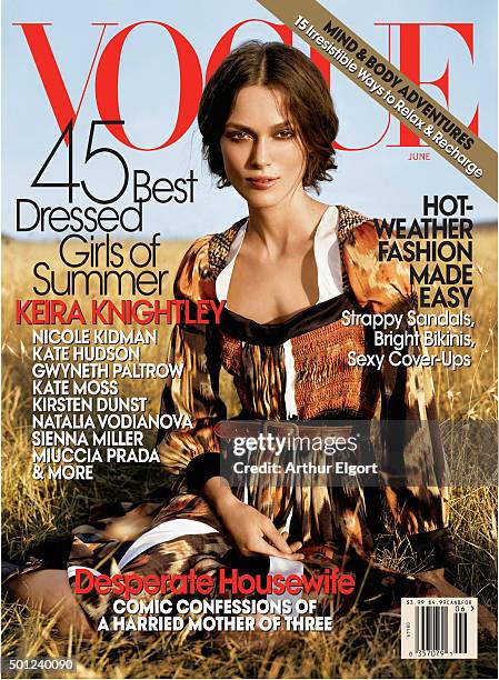British actress Keira Knightley on the cover of Vogue magazine, sitting in the grass wearing a Balenciaga by Nicholas Ghesquiere satin multicolor...