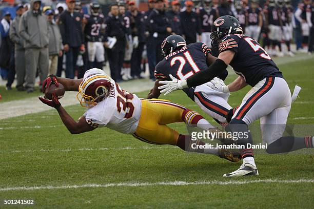 Tanard Jackson of the Washington Redskins is tackled short of the goal by Ryan Mundy and Shea McClellin of the Chicago Bears at Soldier Field on...