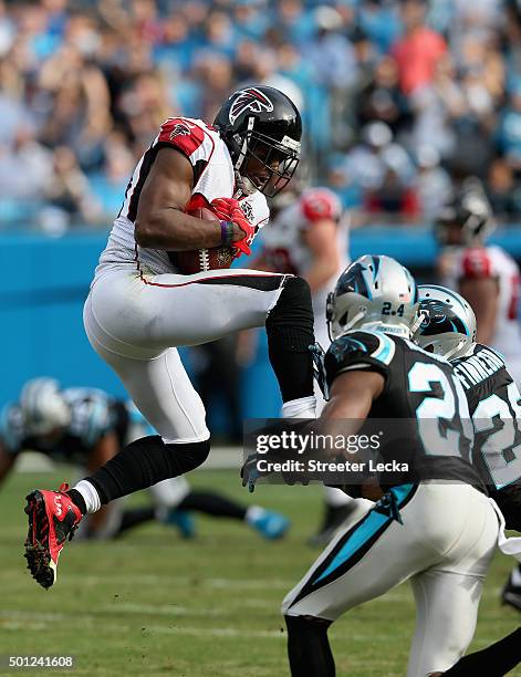 Roddy White of the Atlanta Falcons makes a catch against Cortland Finnegan and teammate Josh Norman of the Carolina Panthers in the 2nd quarter...