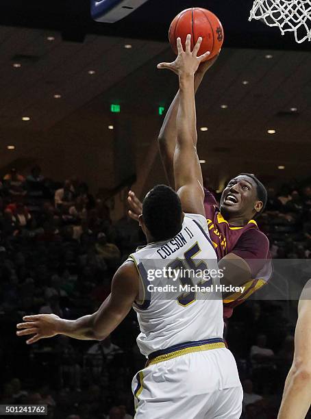 Maurice Kirby of the Loyola Ramblers shoots the ball against Bonzie Colson of the Notre Dame Fighting Irish at Purcell Pavilion on December 13, 2015...