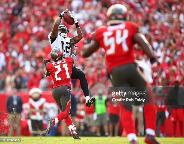 Marques Colston of the New Orleans Saints catches a pass for a first down as Alterraun Verner of the Tampa Bay Buccaneers defends during the second...