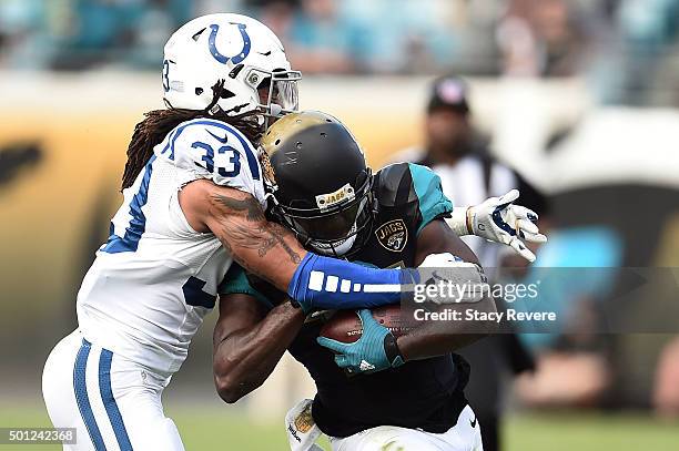 Denard Robinson of the Jacksonville Jaguars is brought down by Dwight Lowery of the Indianapolis Colts during a game at EverBank Field on December...