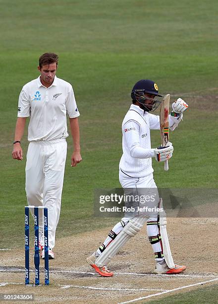 Dinesh Chandimal of Sri Lanka acknowledges his team-mates after scoring 50 runs during day five of the First Test match between New Zealand and Sri...