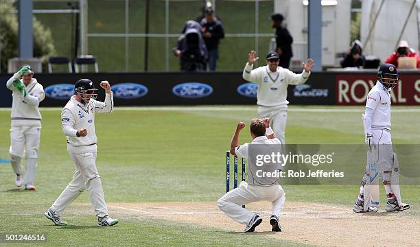 Neil Wagner of New Zealand celebrates a successful LBW decision before it was turned over by the DRS during day five of the First Test match between...