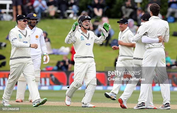 Watling and his New Zealand team-mates rush to congratulate Mitchell Santner of his dismissal of Dinesh Chandimal of Sri Lanka during day five of the...