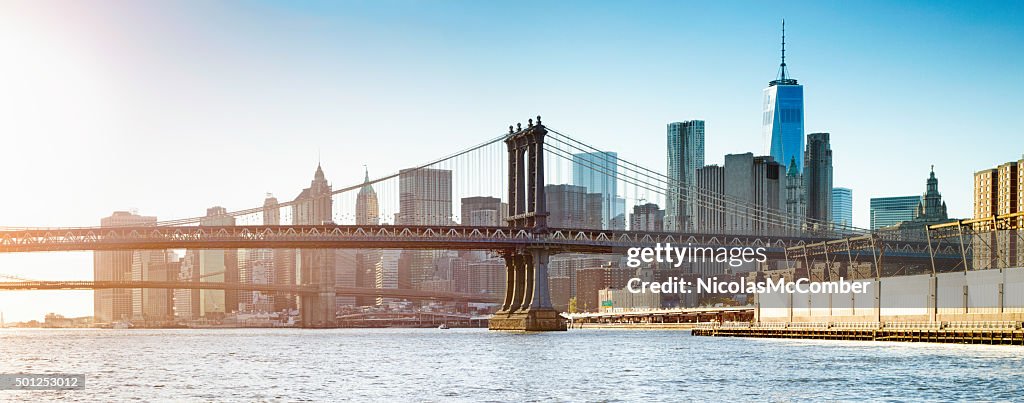 Manhattan bridge at sunset with Manhattan and Wall street