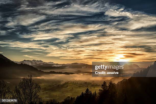 spectacular sunset over landscape at european alps in winter - vorarlberg stockfoto's en -beelden