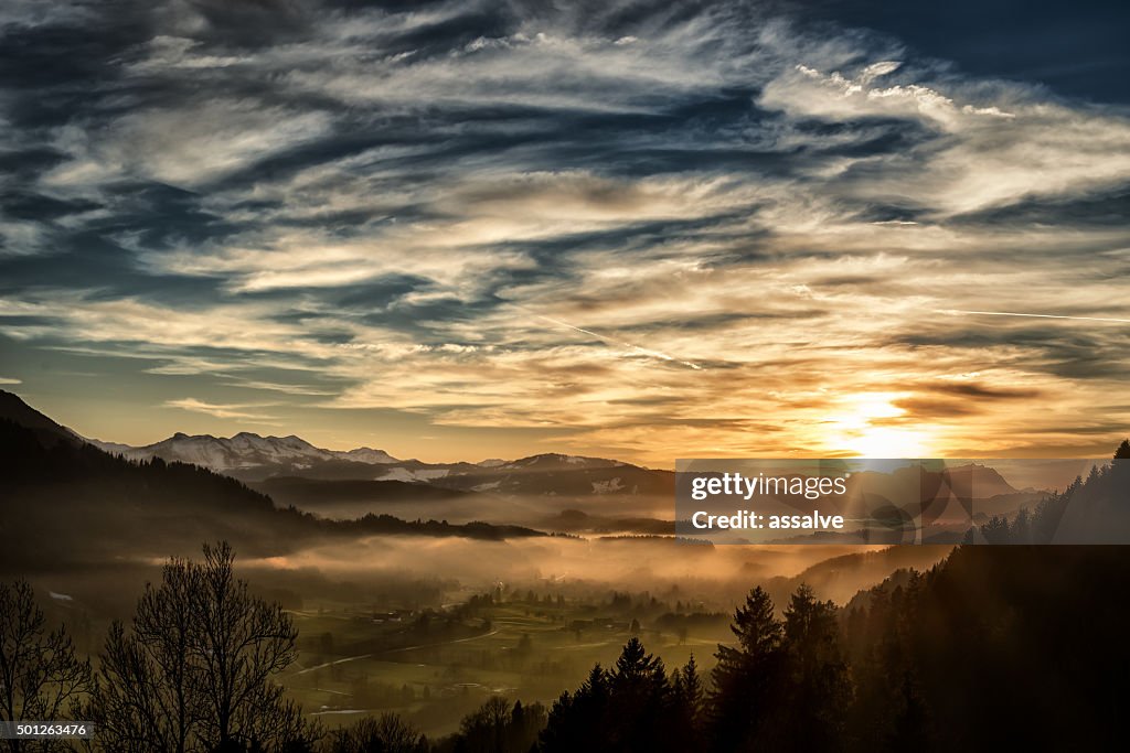 Spectacular sunset over landscape at European alps in winter