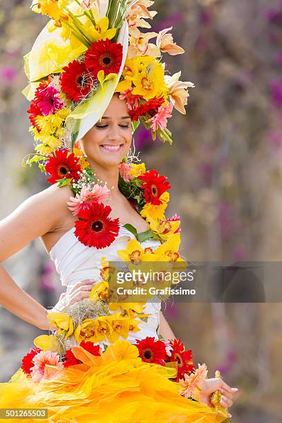 blume festival in madeira, portugal frau auf einer parade - madeira flowers stock-fotos und bilder