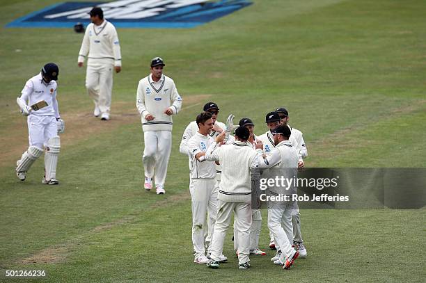 Brendon McCullum of New Zealand is congratulated by his team-mates after pulling in a spectacular catch to dismiss Milinda Siriwardana of Sri Lanka...