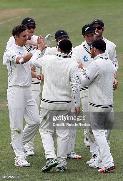 Trent Boult of New Zealand celebrates the catch of Brendon McCullum to dismiss Milinda Siriwardana of Sri Lanka during day five of the First Test...