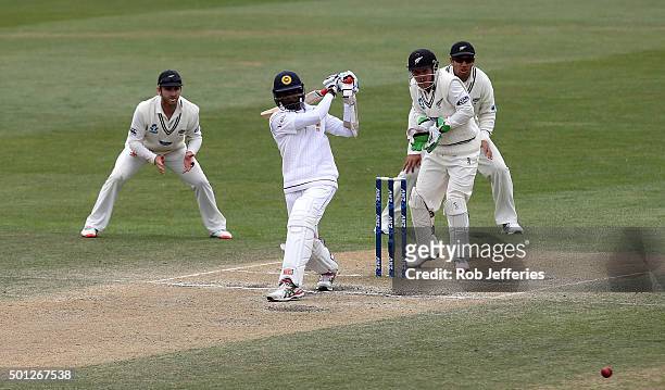 Suranga Lakmal of Sri Lanka hits out during day five of the First Test match between New Zealand and Sri Lanka at University Oval on December 14,...