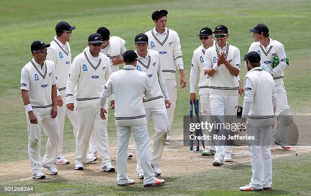 Brendon McCullum of New Zealand shakes the hand of Martin Guptill after he was named man of the match at the end of day five of the First Test match...