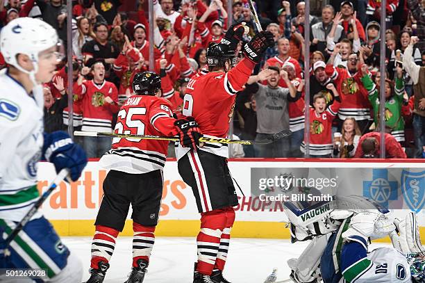 Bryan Bickell of the Chicago Blackhawks reacts after the Blackhawks scored against the Vancouver Canucks in the third period of the NHL game at the...