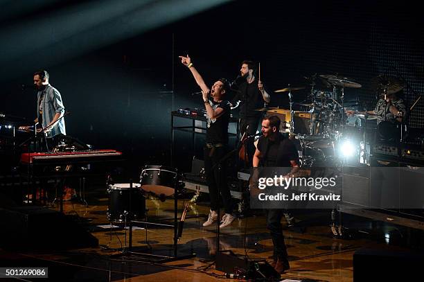 Musicians Kyle J Simmons, Dan Smith, Chris 'Woody' Wood and Will Farquarson of Bastille perform onstage during 106.7 KROQ Almost Acoustic Christmas...