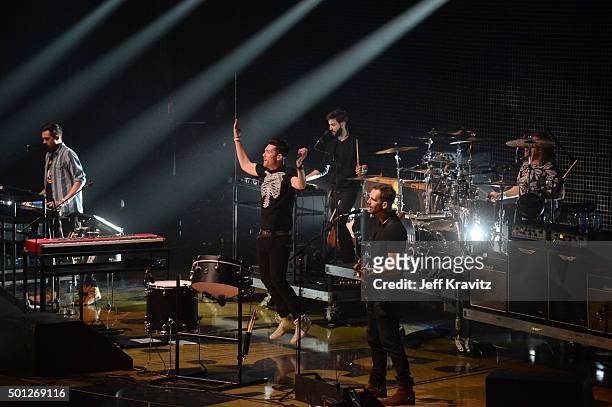 Musicians Kyle J Simmons, Dan Smith, Chris 'Woody' Wood and Will Farquarson of Bastille perform onstage during 106.7 KROQ Almost Acoustic Christmas...