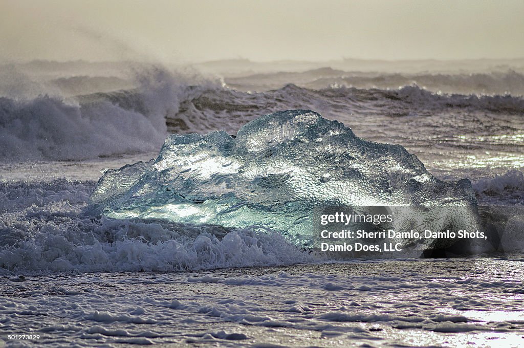 Iceberg being tossed in the surf