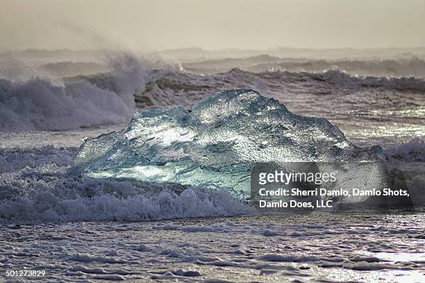 iceberg being tossed in the surf - damlo does stock pictures, royalty-free photos & images