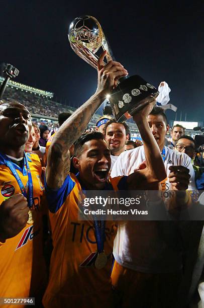 Javier Aquino of Tigres celebrates with the trophy after his team's victory in the final second leg match between Pumas UNAM and Tigres UANL as part...