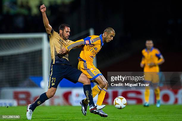 Alejandro Castro of Pumas fights for the ball with Guido Pizarro of Tigres during the final second leg match between Pumas UNAM and Tigres UANL as...