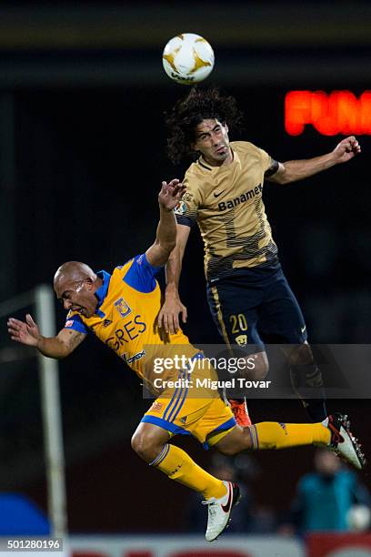 Matias Britos of Pumas fights for the ball with Egidio Arevalo of Tigres during the final second leg match between Pumas UNAM and Tigres UANL as part...