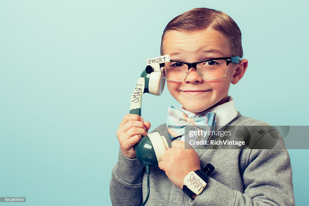 Young Boy Nerd Using Smart Phone and Glasses