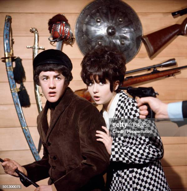 English singer and actor Adrienne Posta pictured with actor Kenneth Nash in a scene from the television drama 'Action' in 1966.