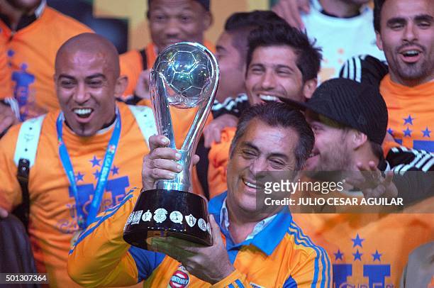 Tigres' team and the Governator of Nuevo Leon Jaime "EL Bronco" Rodriguez pose with the trophy after winning the Mexican Apertura 2015 tournament...