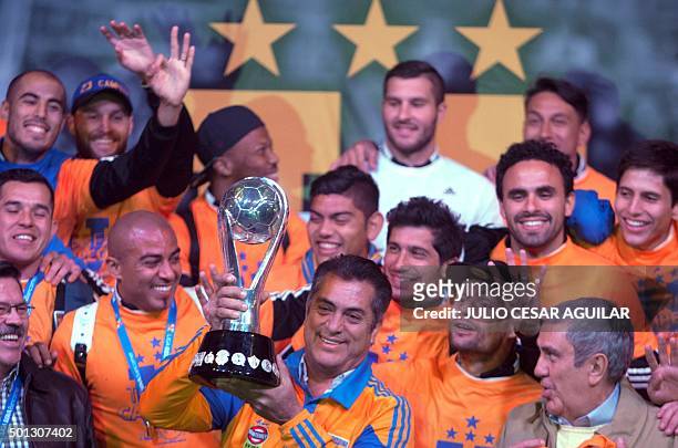 Tigres' team and the Governator of Nuevo Leon Jaime "EL Bronco" Rodriguez pose with the trophy after winning the Mexican Apertura 2015 tournament...