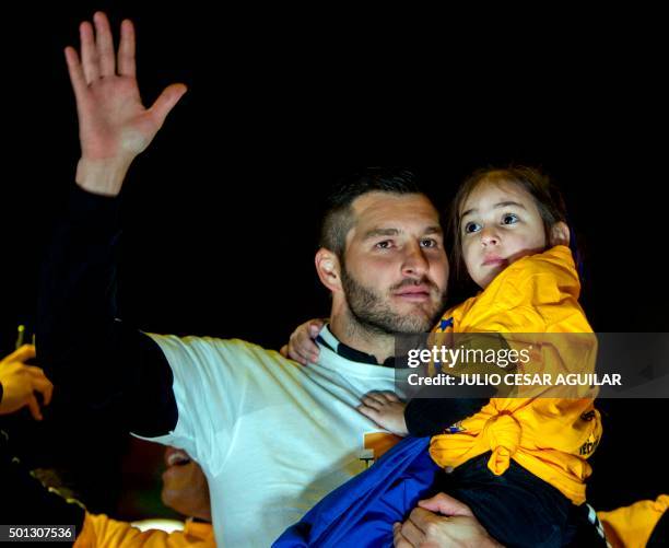 Andre Pierre Gignac, forward of Tigres, greets the fans in company of his daughter during the celebration after winning their Mexican Apertura 2015...