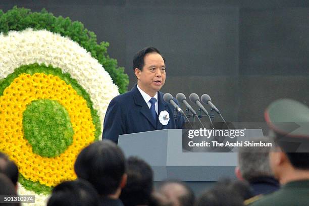 The National People's Congress Vice-Chairman Li Jianguo addresses during the state ceremony for victims of Nanjing Massacre on China's second...