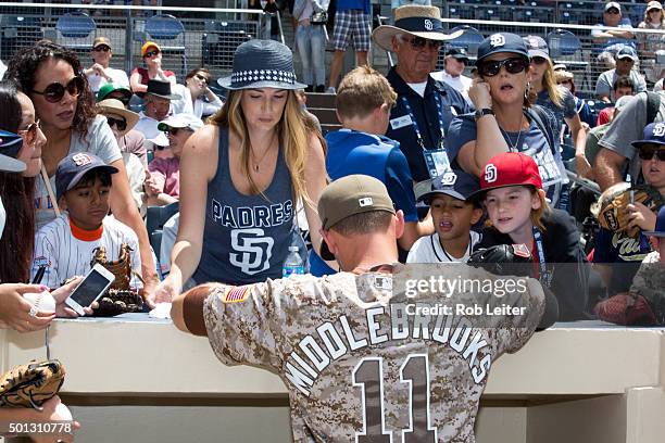 Will Middlebrooks of the San Diego Padres signs autographs before the game against the Colorado Rockies at Petco Park on Sunday, May 3, 2015 in San...