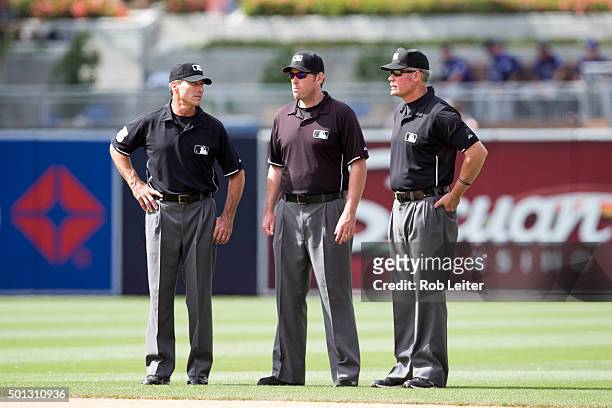 Umpires Angel Hernandez Chris Conroy and Ted Barrett look on during the game between the Colorado Rockies and the San Diego Padres at Petco Park on...
