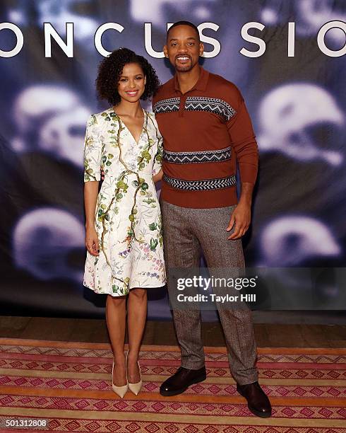 Actress Gugu Mbatha-Raw and actor Will Smith attends a photocall for "Concussion" at Crosby Street Hotel on December 14, 2015 in New York City.