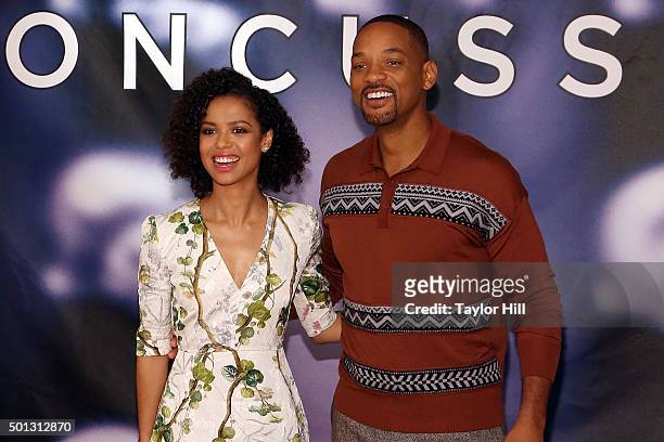 Actress Gugu Mbatha-Raw and actor Will Smith attends a photocall for "Concussion" at Crosby Street Hotel on December 14, 2015 in New York City.
