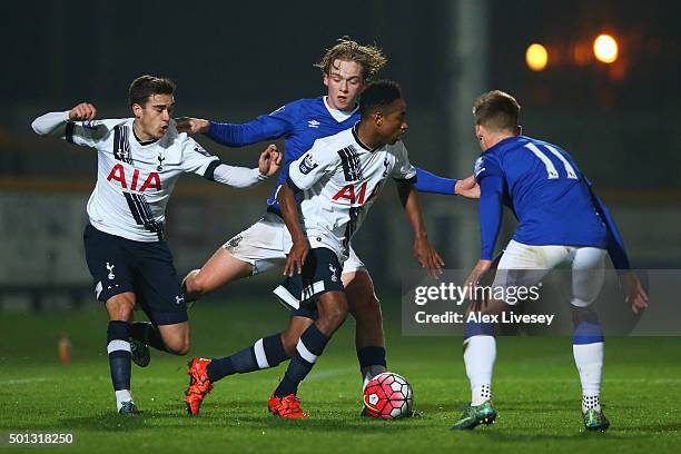 Kyle Walker-Peters of Spurs U21s is closed down by Tom Davies and Conor McAleny of Everton U21s during the Barclays U21 Premier League match between...