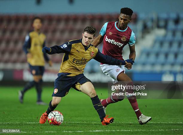 Dan Crowley of Arsenal takes on Reece Oxford of West Ham during match between West Ham United U21 and Arsenal U21 at Boleyn Ground on December 14,...