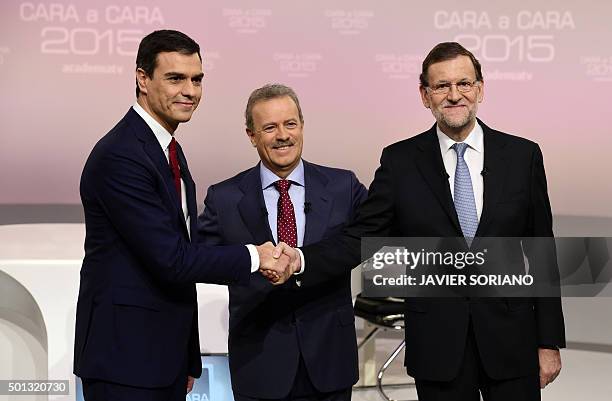 Spanish Prime Minister and Popular Party leader and candidate in the December 20 general elections, Mariano Rajoy shakes hands with Spanish Socialist...