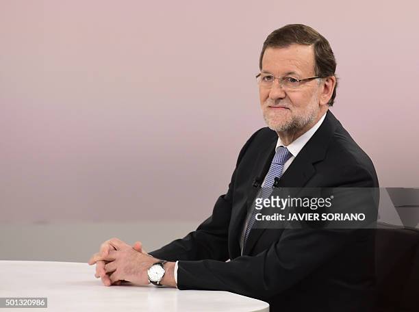 Spanish Prime Minister and Popular Party leader and candidate in the December 20 general elections, Mariano Rajoy poses before a face to face TV...