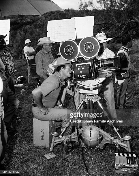 Actor and director John Wayne behind the camera during the filming of "The Alamo" in Texas in 1960.